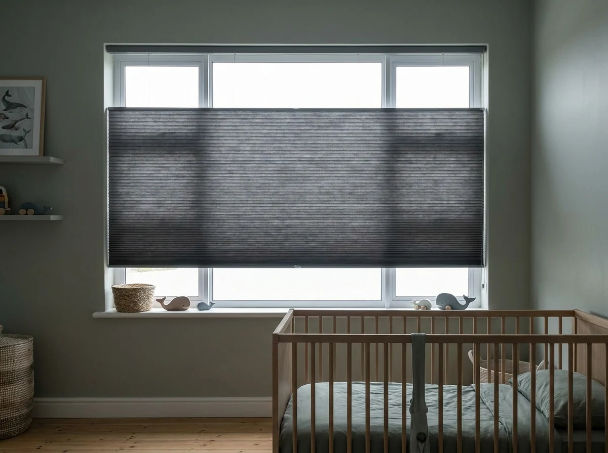 Cellular honeycomb blind lowered for blackout on a nursery window in a Hermanus family home